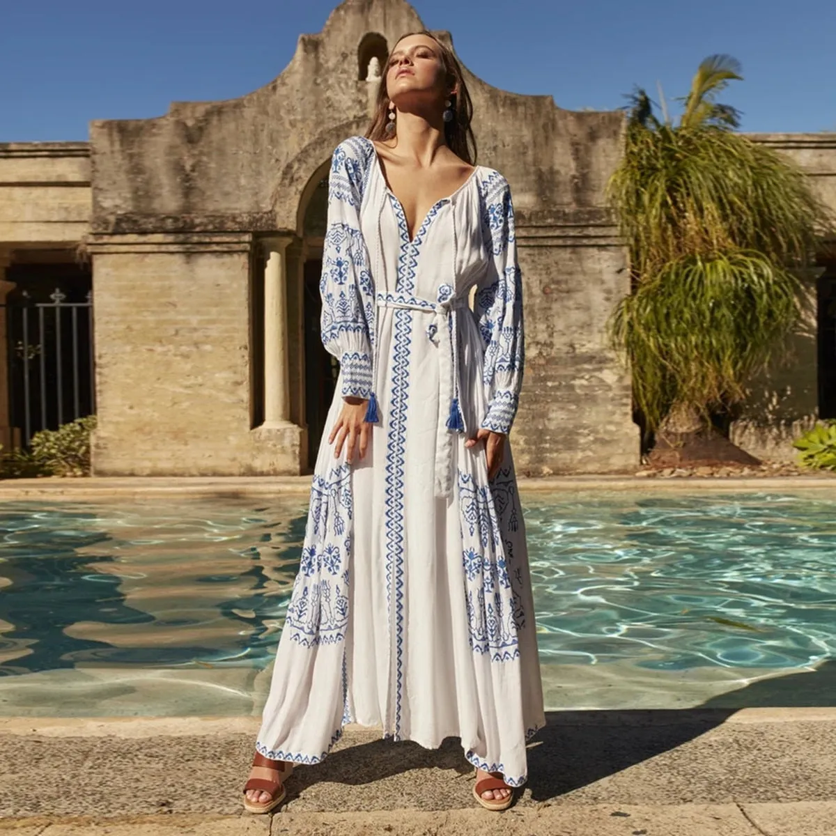 Bahia Maxi Dress White With Blue Embroidery Long Puffed Peasant Sleeves Embroidered Pockets Bohemian Tassel Ties Available In Small Medium Large Or XL