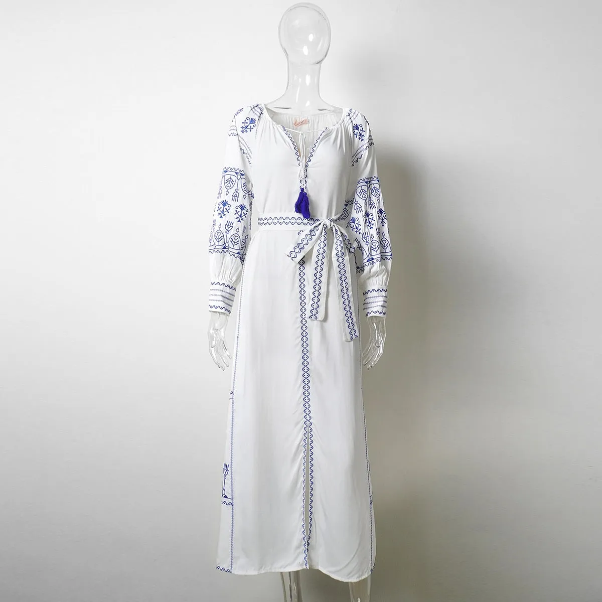 Bahia Maxi Dress White With Blue Embroidery Long Puffed Peasant Sleeves Embroidered Pockets Bohemian Tassel Ties Available In Small Medium Large Or XL