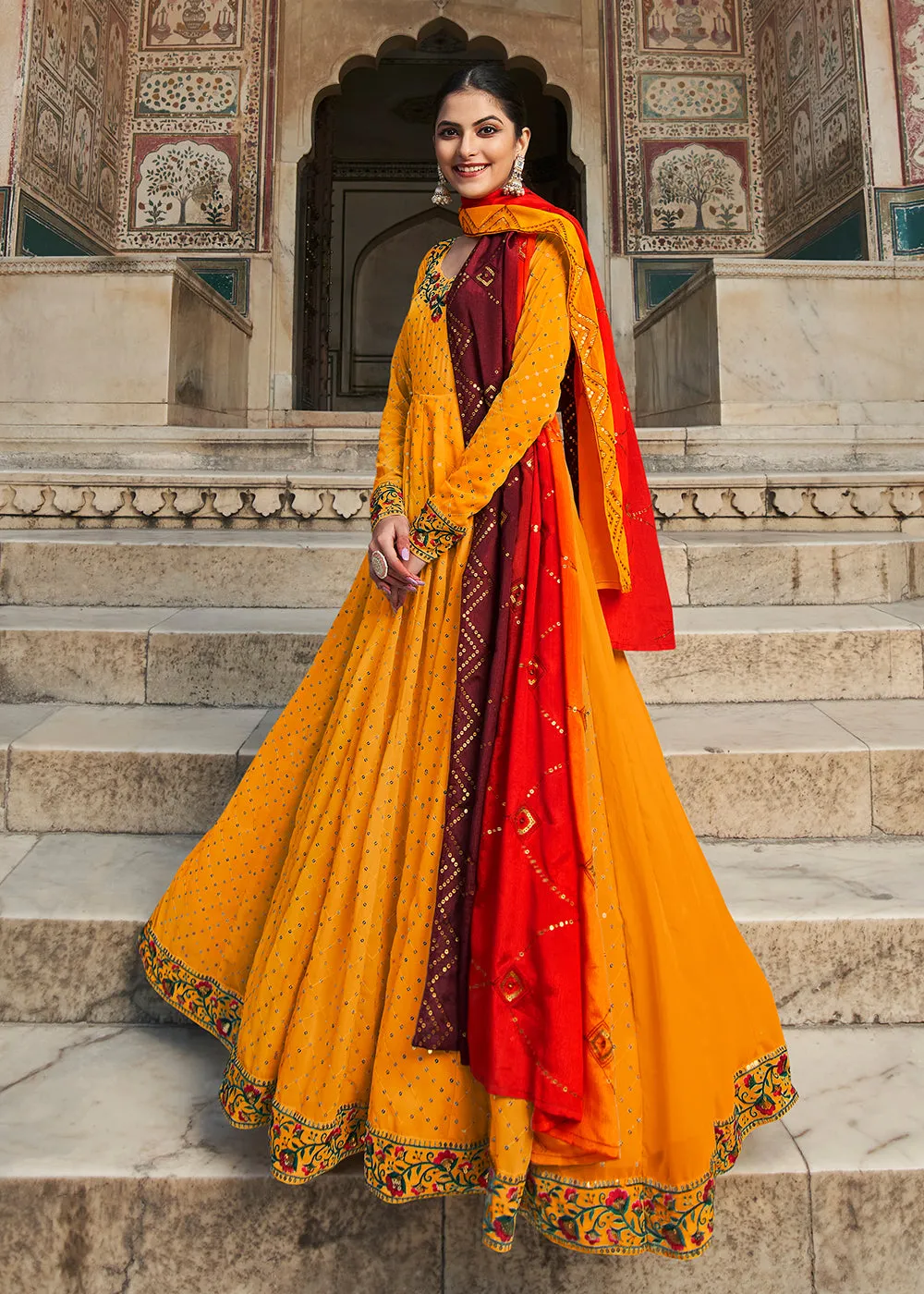 Fascinating Yellow Sequins Georgette Party Wear Festive Gown